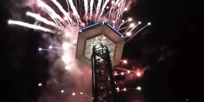 fireworks being shot off from the gatlinburg space needle on new years