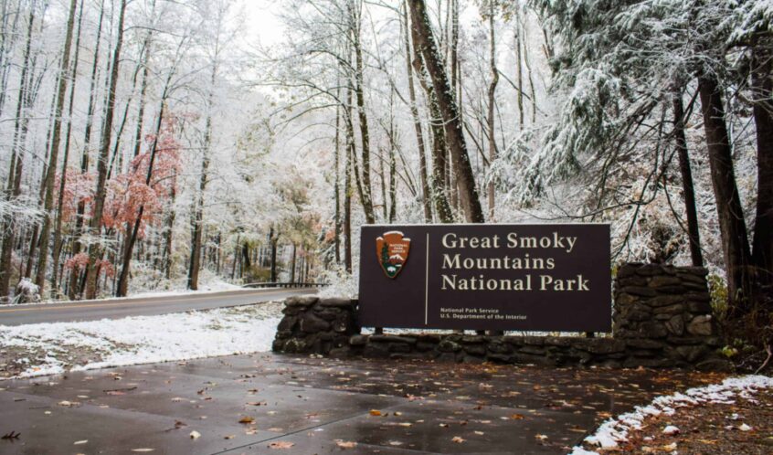 great smoky mountains national park sign covered in snow